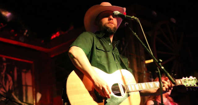 Drew Moreland playing guitar