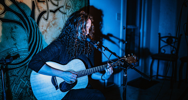 Jeremy Couture playing guitar