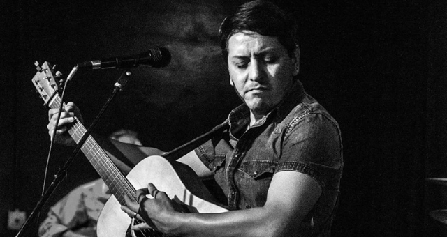 Jerry Serrano playing guitar