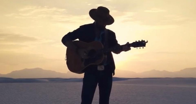 Phil Coggins posing with guitar